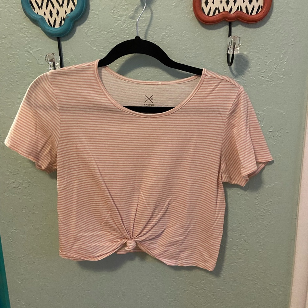 pink and white cropped shirt